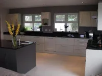 Grey, white and black kitchen with chrome handles