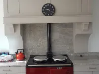 light grey kitchen with red cooker