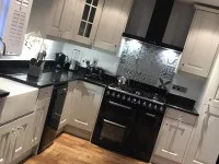 White kitchen with black apliances